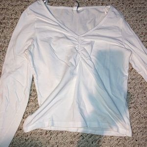 Divided white long sleeve cinch top